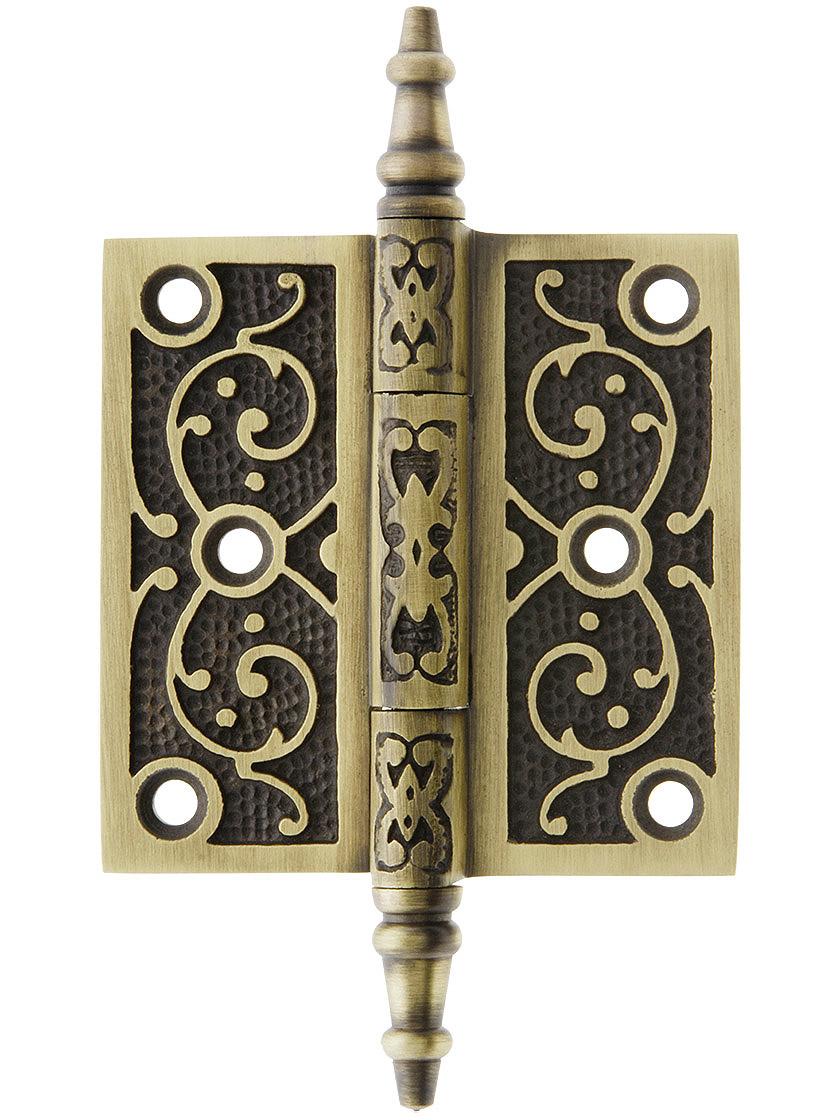 3 inch Cast Iron Steeple Tip Hinge With Decorative Vine Pattern In Antique Brass